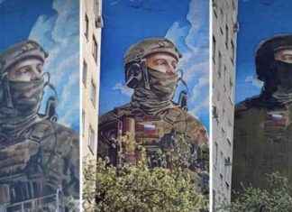 Росіяни малюють пропагандистський мурал зі зображенням ШІ, використаним розвідкою української армії